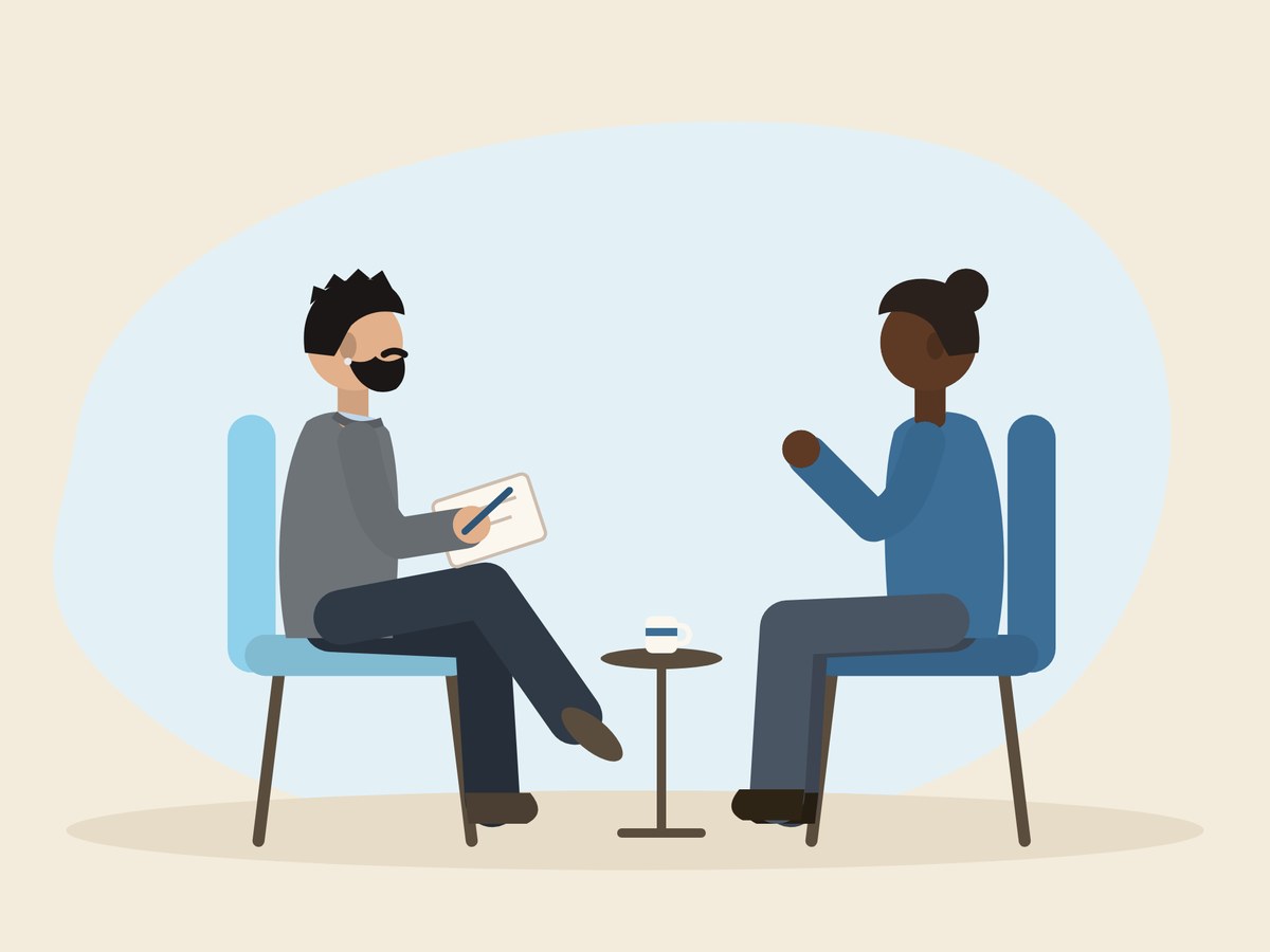 Illustration of a counsellor and client talking in armchairs